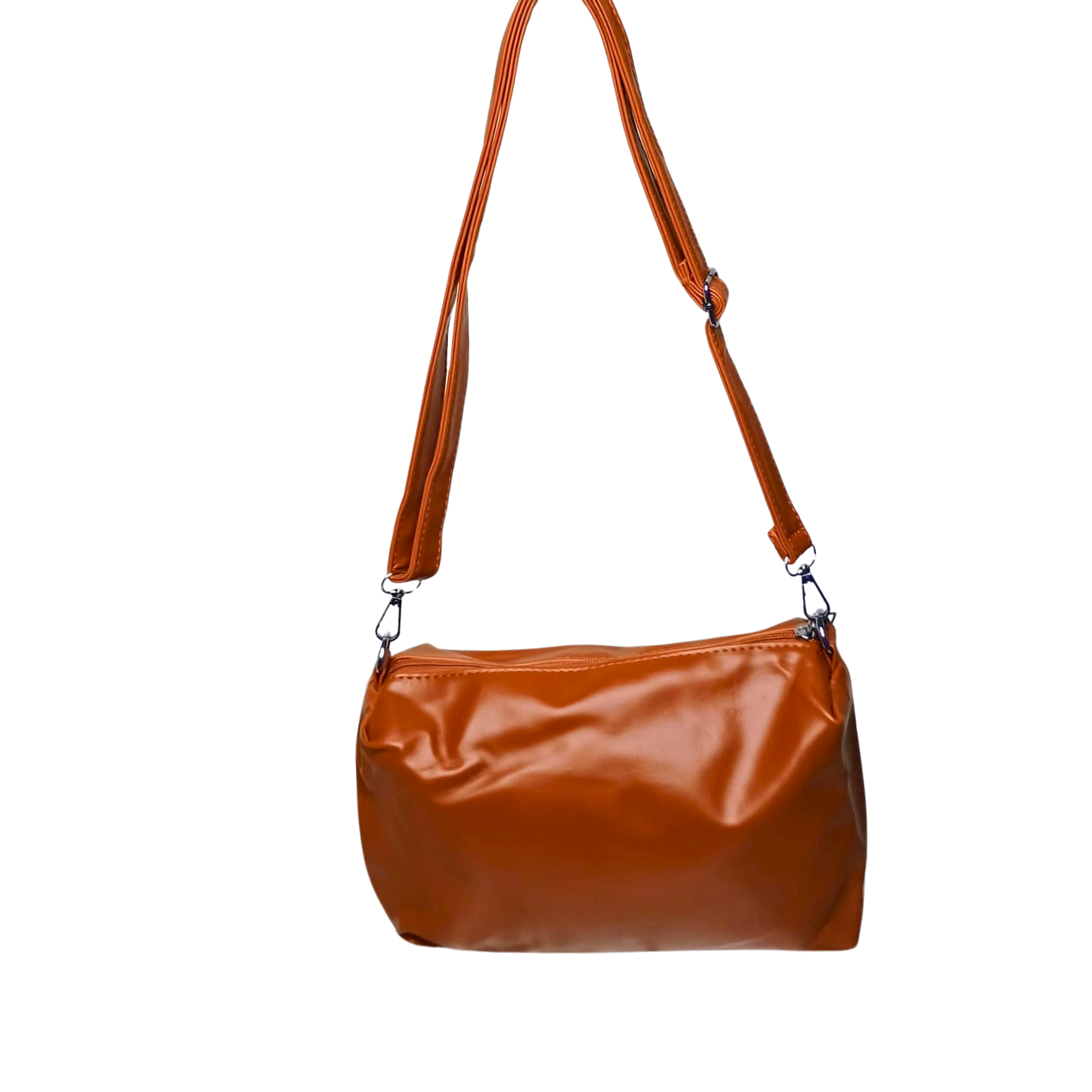 Brown leather handbag with a strap on a white background