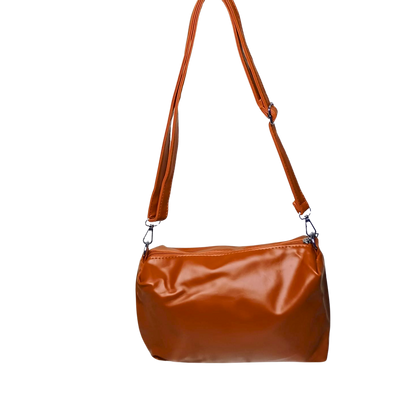 Brown leather handbag with a strap on a white background
