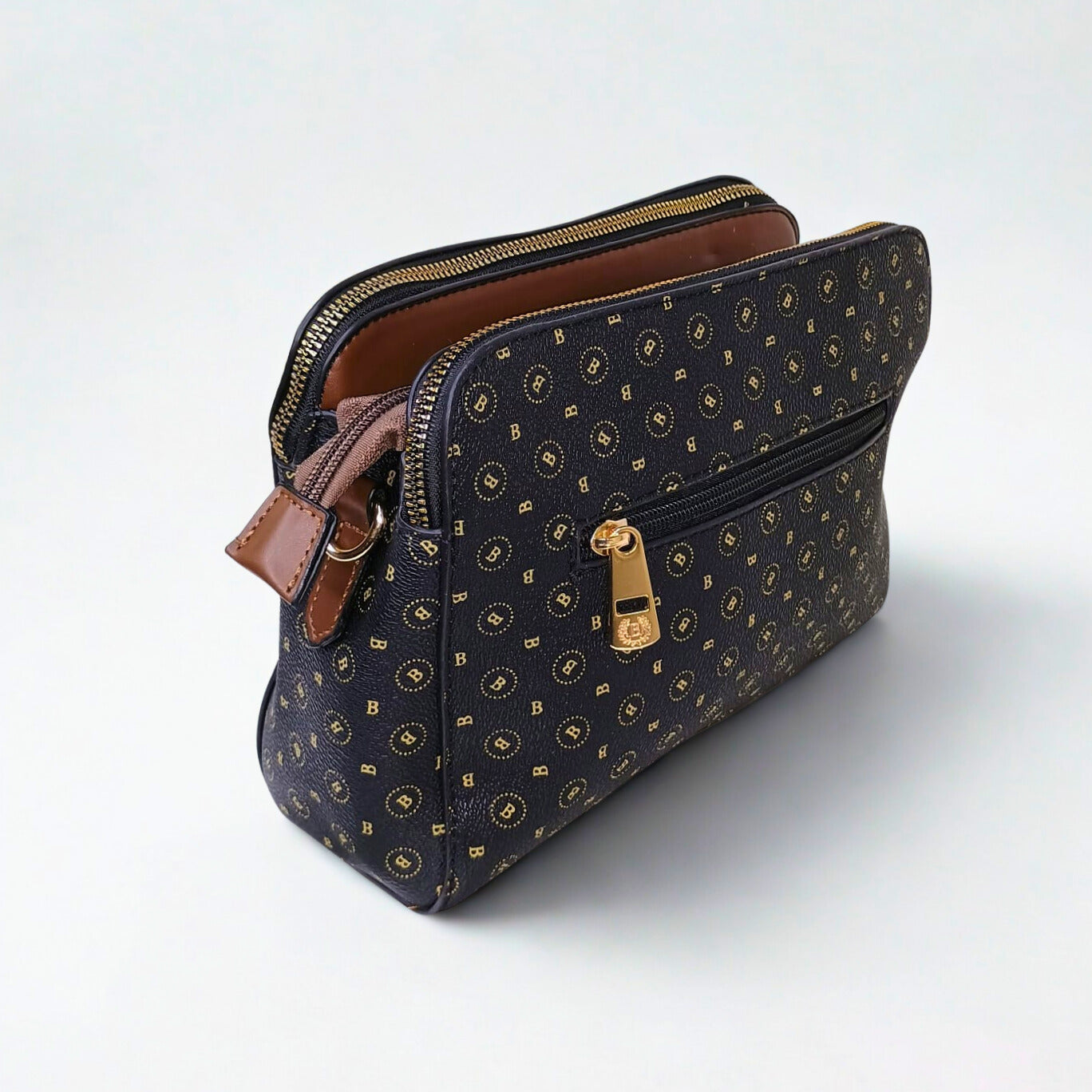 Patterned handbag with gold accents on a white background