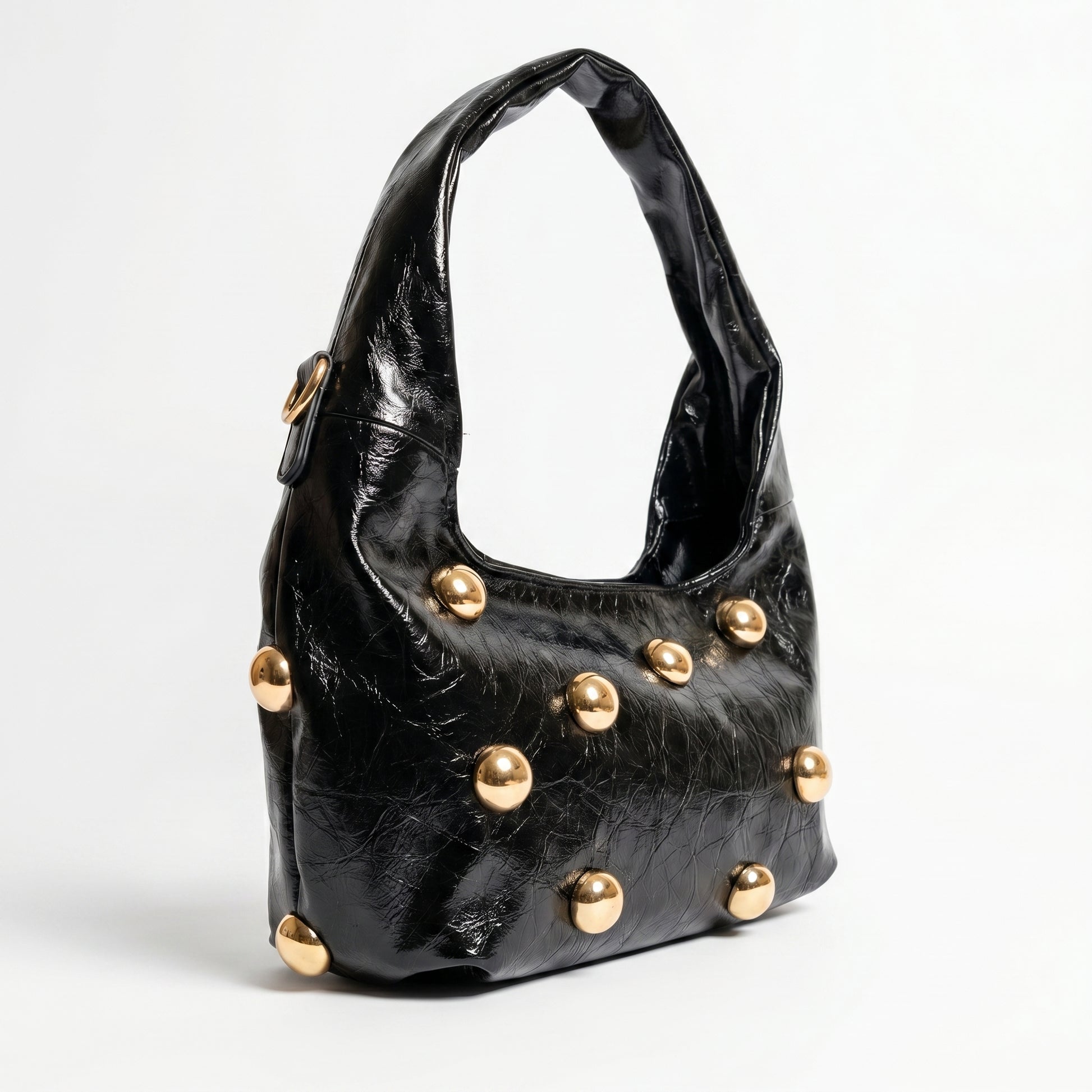 Borsa hobo Coconuda nera con borchie oversize dorate - dettaglio