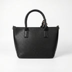 Black handbag on a white background