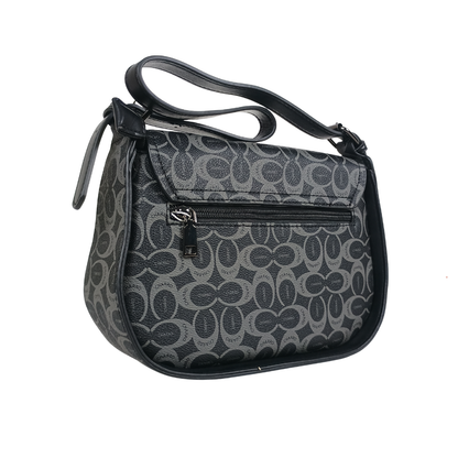 Black handbag with a pattern on a white background