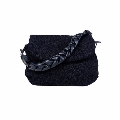 Black textured handbag with braided handle on a white background
