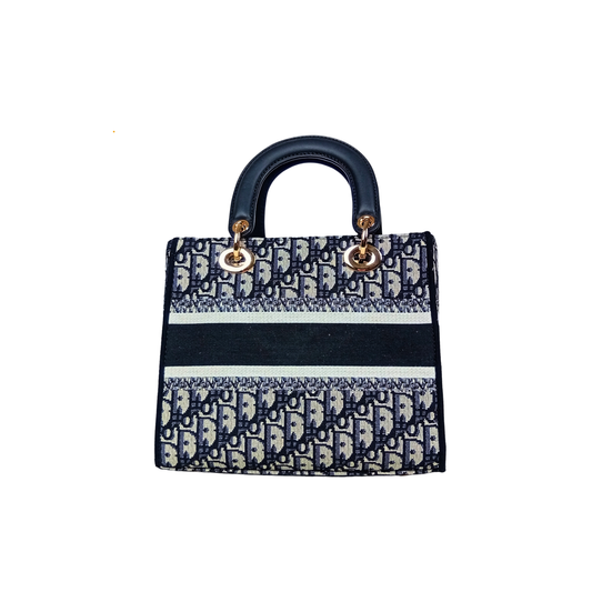 Designer handbag with a distinctive pattern on a white background