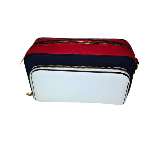 Multicolored cosmetic bag with red, white, and navy sections on a white background