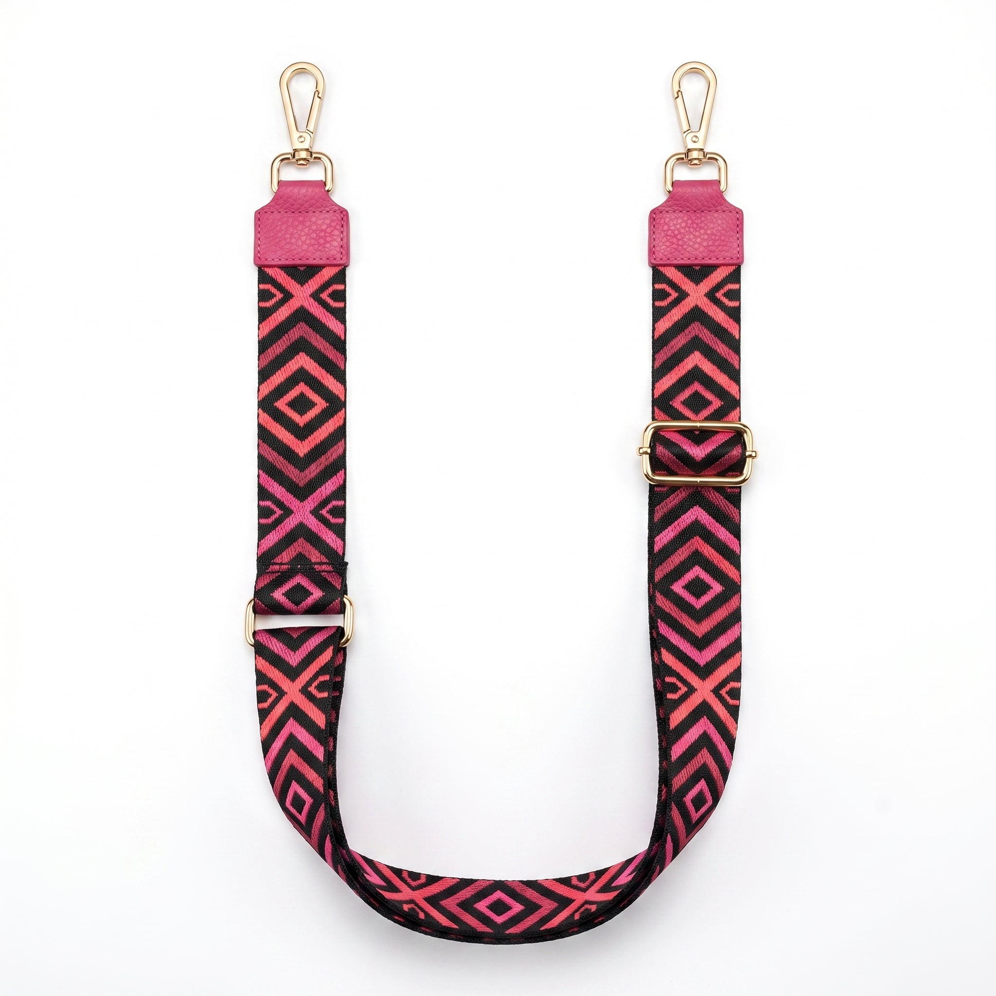 Pink and black geometric patterned strap with gold hardware on a white background