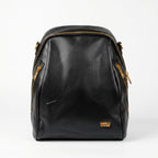 Black leather backpack with gold zippers on a white background