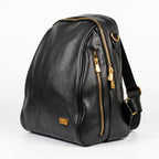 Black leather backpack with gold zippers on a white background