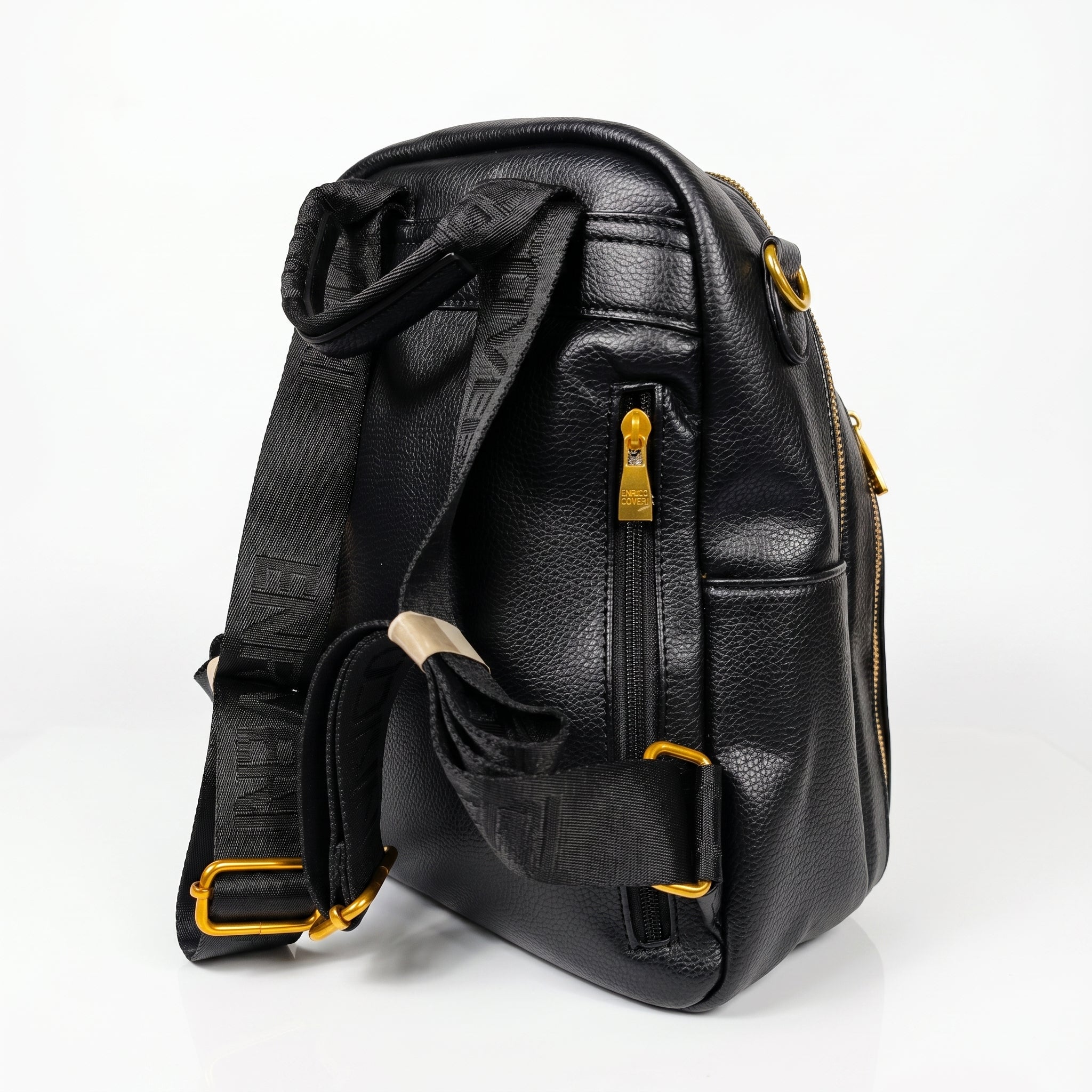 Black leather backpack with yellow zippers on a white background