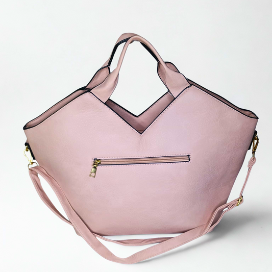 Pink handbag with a strap on a light gray background