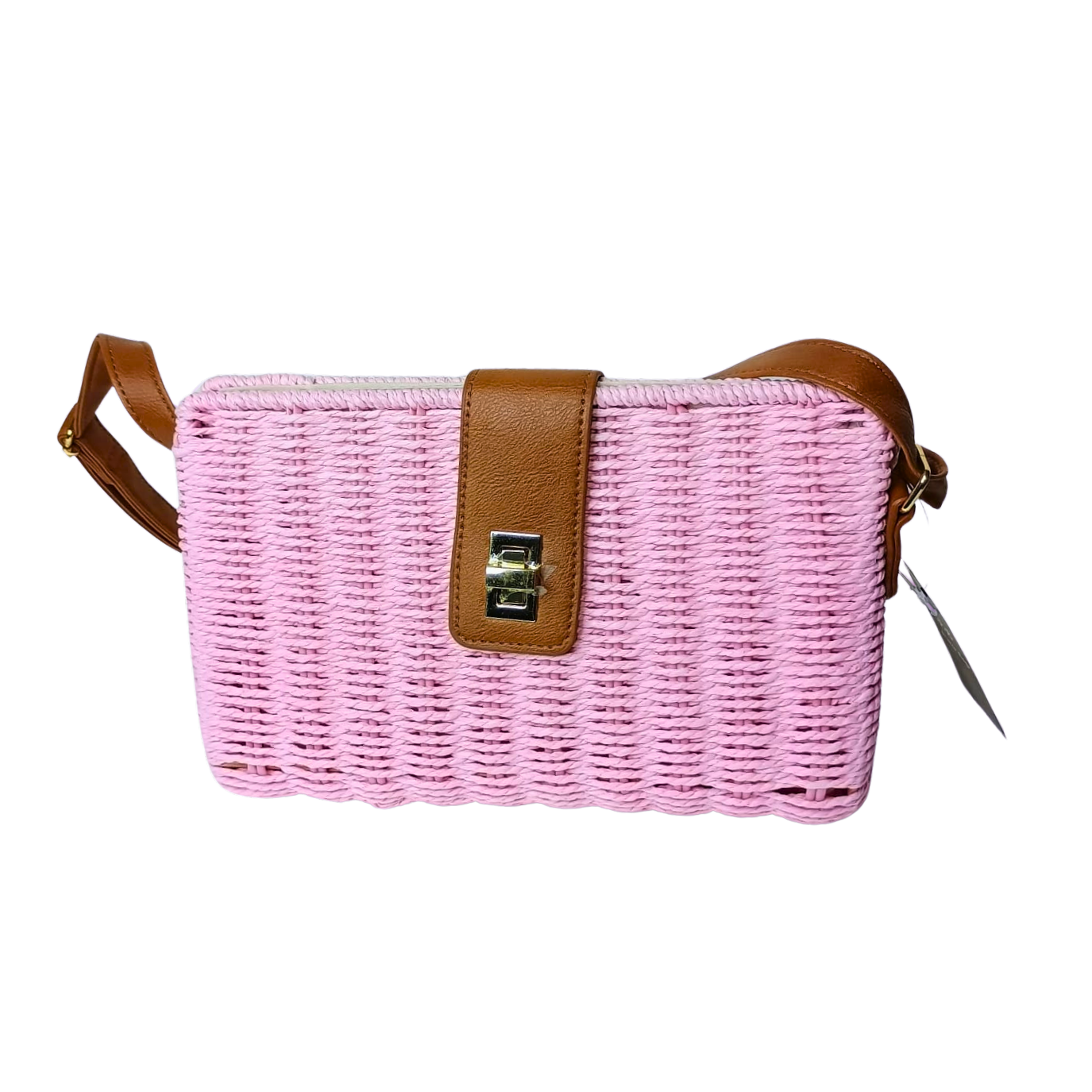 Pink woven handbag with brown leather strap on a white background