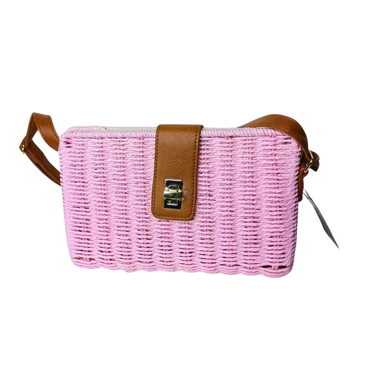 Pink woven handbag with brown leather strap on a white background
