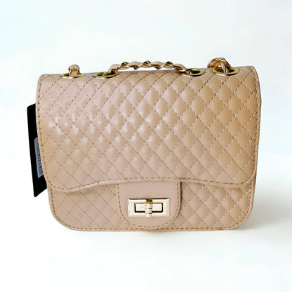 Beige quilted handbag with gold chain strap on a white background