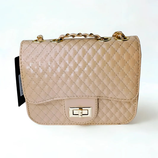 Beige quilted handbag with gold chain strap on a white background