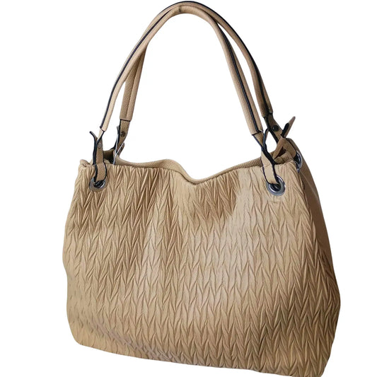Beige handbag with textured pattern on a light background