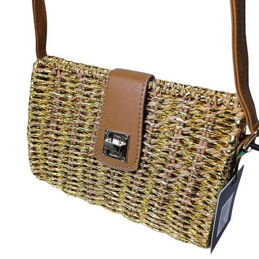 Woven handbag with brown leather strap and tag on a white background