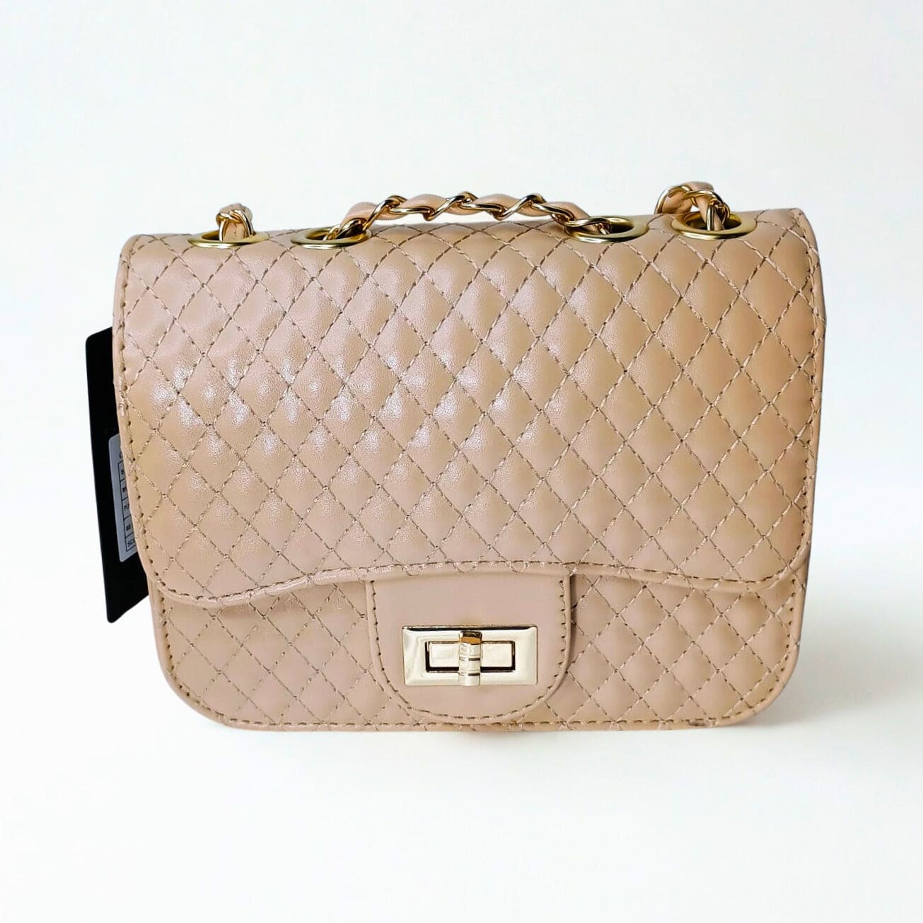 Beige quilted handbag with gold chain strap on a white background