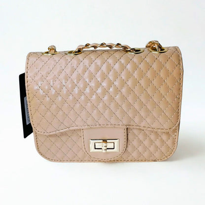Beige quilted handbag with gold chain strap on a white background