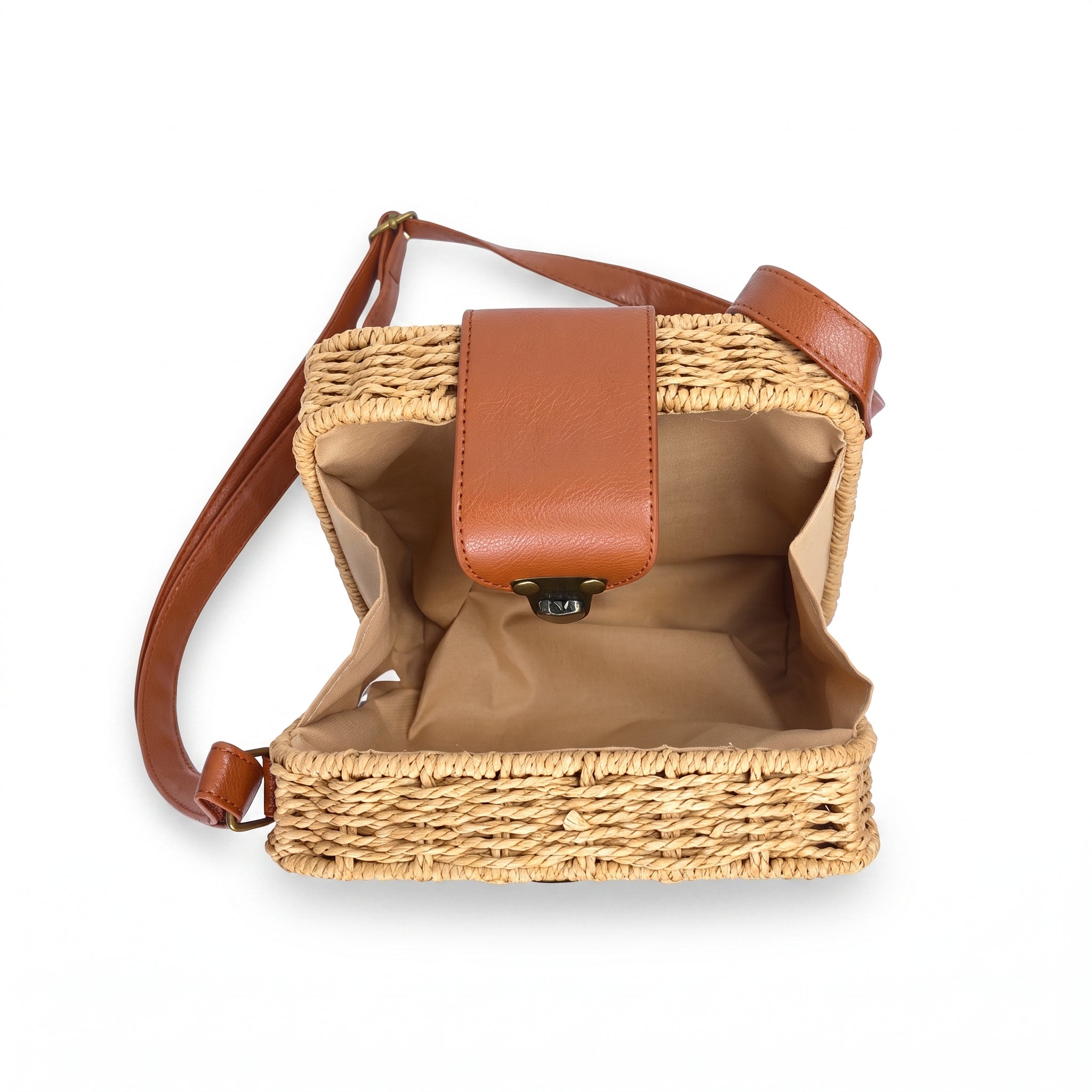 Woven bag with brown leather accents on a white background