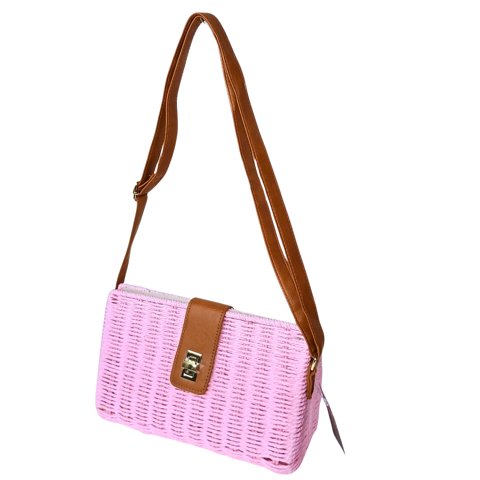 Pink woven handbag with brown leather strap on a white background