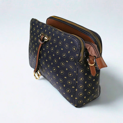Patterned handbag with brown accents on a light gray background