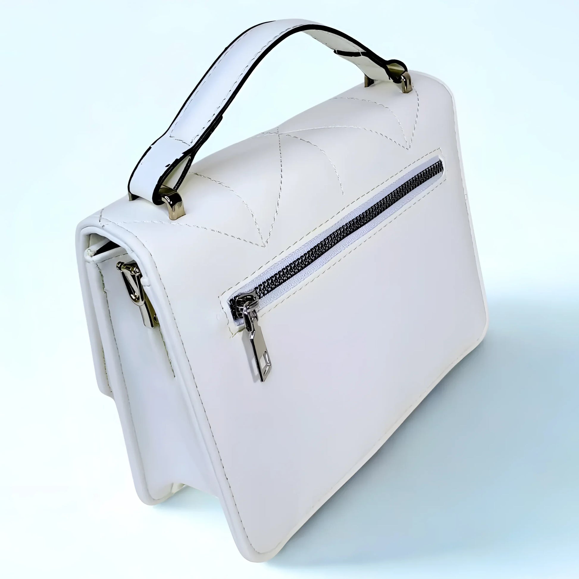 White handbag with a zipper on a light blue background