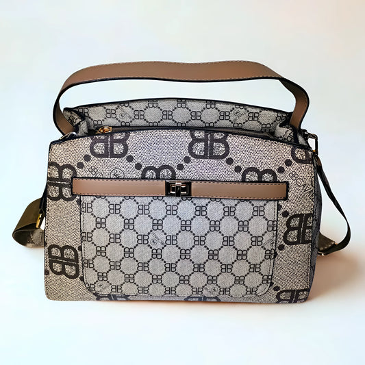 Patterned handbag with brown accents on a white background