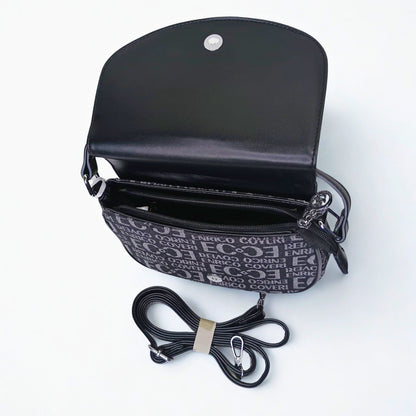 Black handbag with a detachable strap on a white background