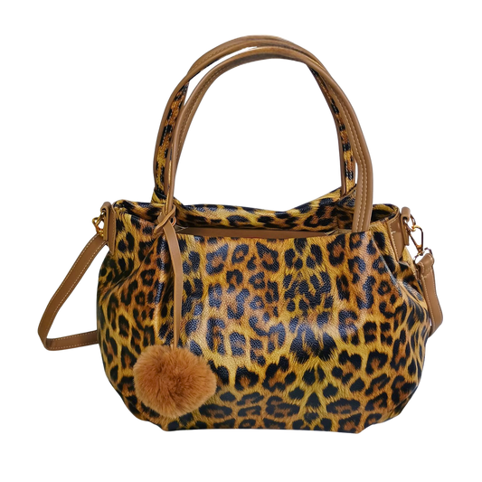 Leopard print handbag with a brown pom-pom on a white background