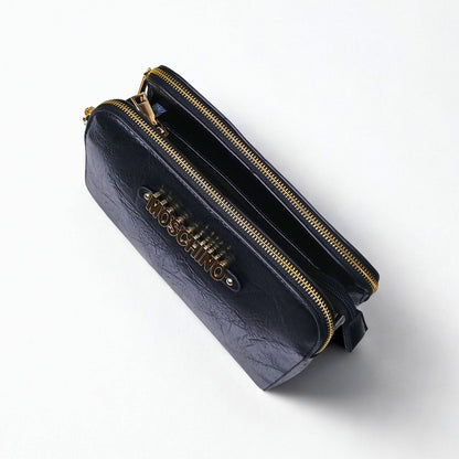 Black handbag with gold zipper and Moschino logo on a white background