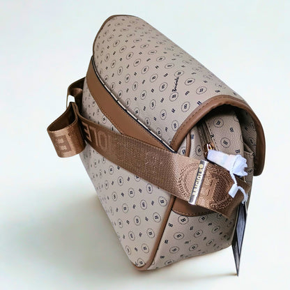 Patterned bag with brown strap on a light background