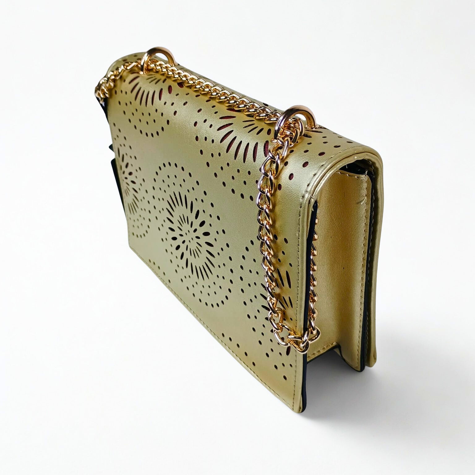 Gold handbag with chain strap on a white background