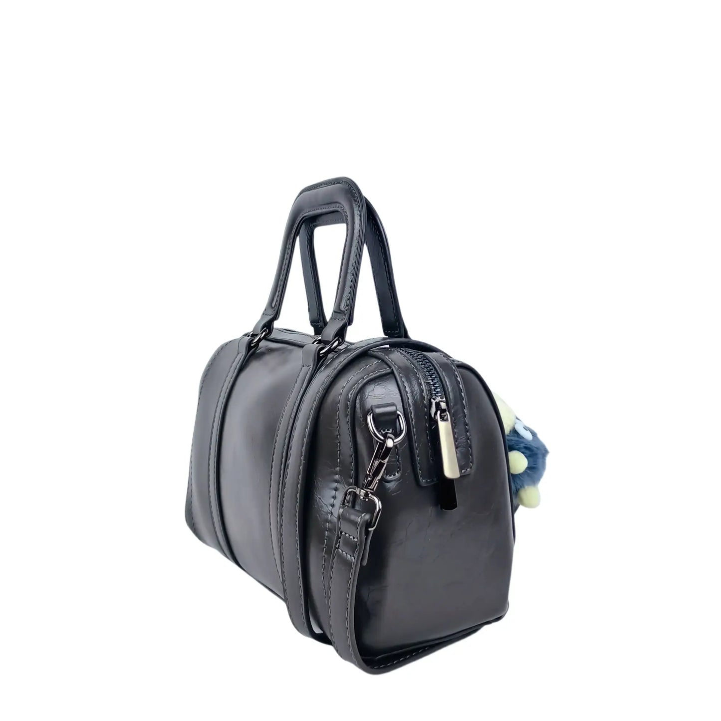 Dark gray ladies designer handbag with removable shoulder strap and decorative pom-pom charm