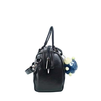Dark gray ladies designer handbag with removable shoulder strap and fuzzy blue monster keychain