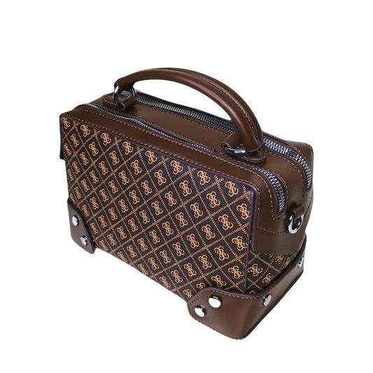 Brown handbag with patterned front section on a white background