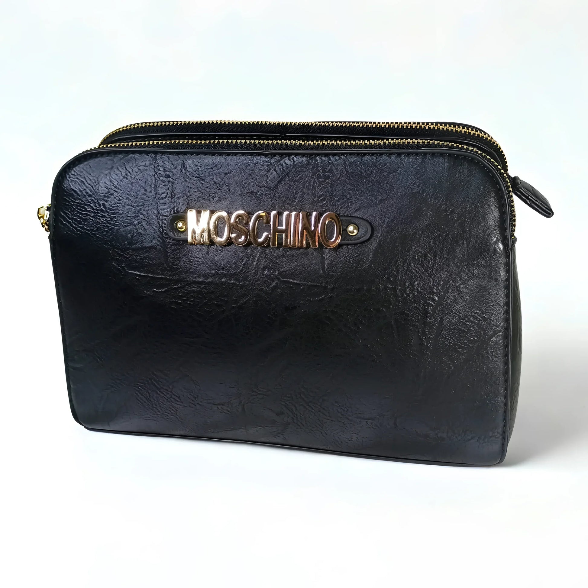 Black leather pouch with gold zipper and Moschino logo on a white background