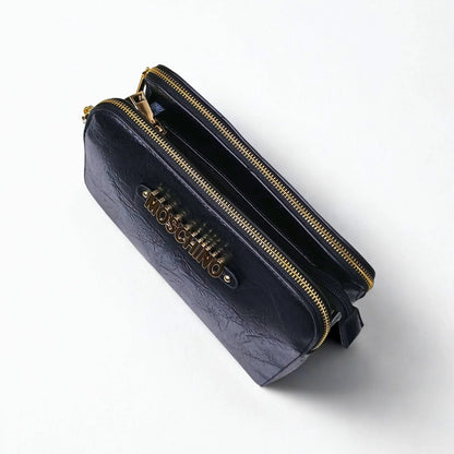 Black handbag with gold zipper and Moschino logo on a white background