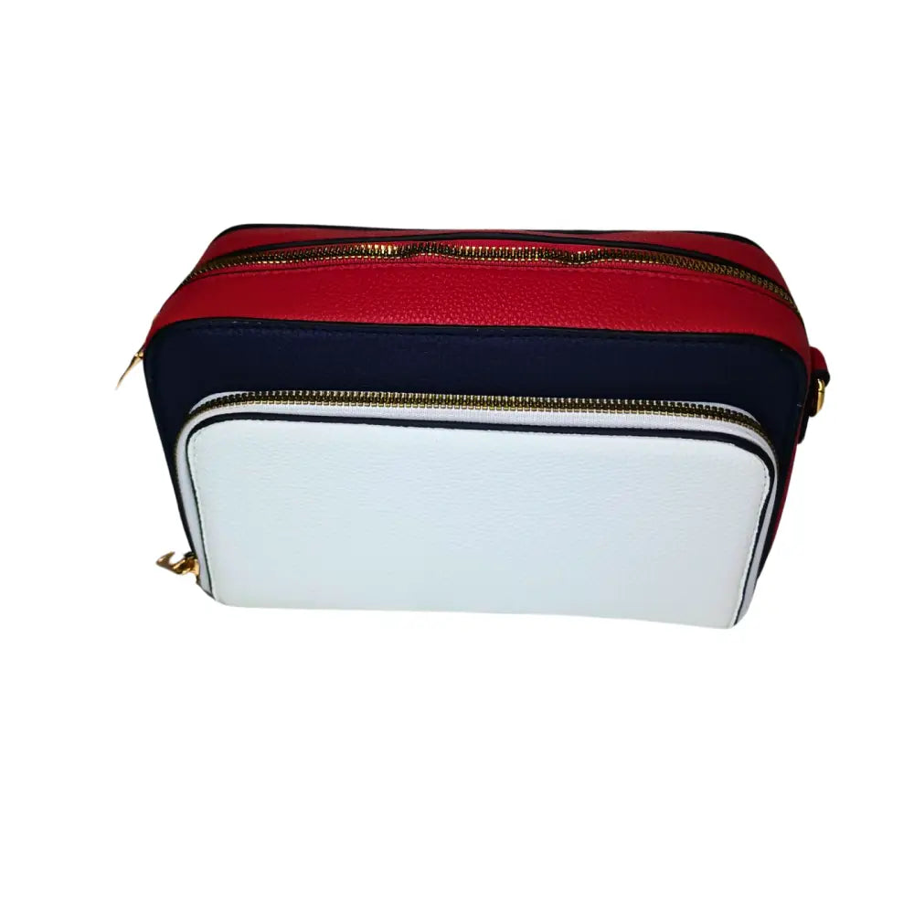 Multicolored cosmetic bag with red, white, and navy sections on a white background