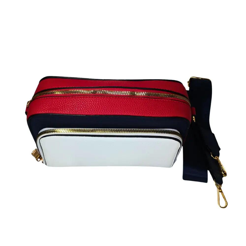 Multicolored bag with gold zippers on a white background