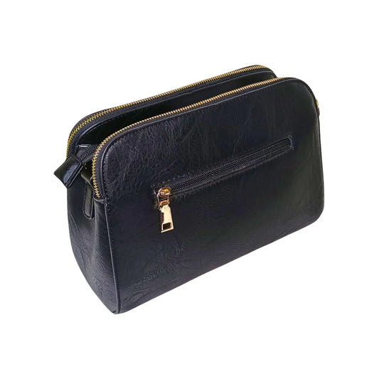 Black leather handbag with gold zipper on a white background