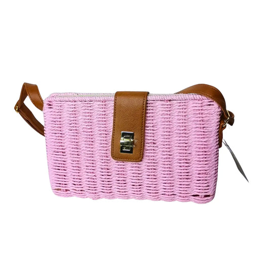Pink woven handbag with brown leather strap on a white background